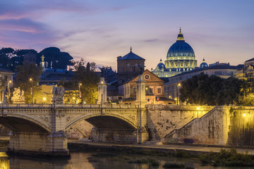 Fototapeta premium St. Peter's cathedral (Basilica di San Pietro) and bridge over river Tiber at evening, Rome, Italy, Europe 