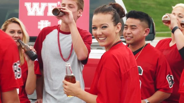 Tailgate: Girl Having Fun With Friends Turns To Camera
