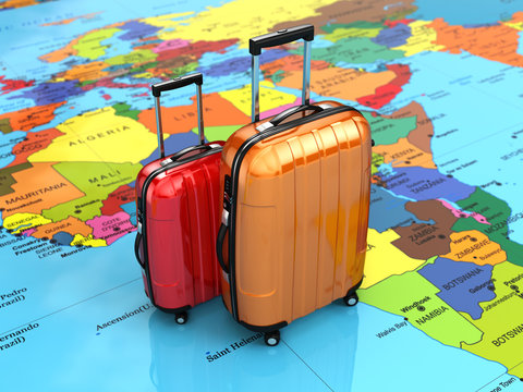 Travel or tourism concept. Luggage on the world map.