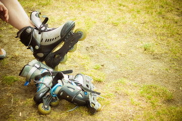 Man putting on roller skates