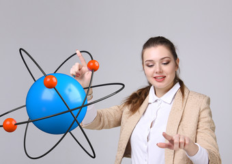 Woman scientist with atom model, research concept