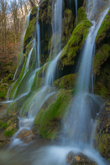 Fototapeta premium Beautiful waterfalls and mountain stream in Transylvania, in early spring