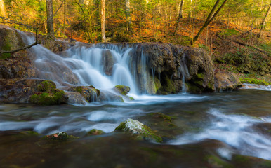 Fototapeta na wymiar Beautiful waterfalls and mountain stream in Transylvania, in early spring