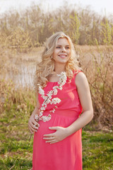 Fototapeta na wymiar Young happy pregnant woman