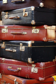 Pile of colorful vintage suitcases