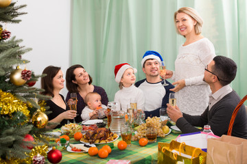 family with children celebrates Christmas