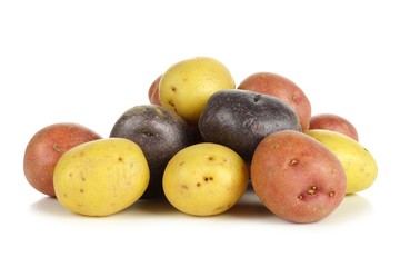 Pile of colorful fresh little potatoes over a white background - obrazy, fototapety, plakaty