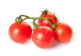 Bunch of fresh cherry tomatoes isolated on white background
