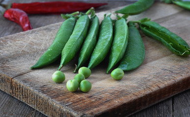Green peas on the wood backgraund.