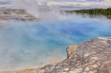 Visitors at the Excelsior Geyser Crater next to the Grand Prismatic Spring, Yellowstone National Park