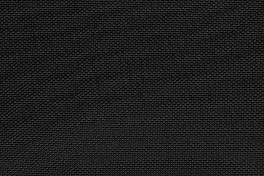 Fototapeta Black gray fishnet cloth material as a texture background. 
