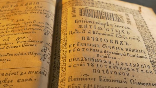 Ancient Slavic Style of Letters Patericon Panorama of a Book of Kiev-Pechersk Lavra Stories of a Lives of the Lavra's Saints Light of Candle in Dark Room