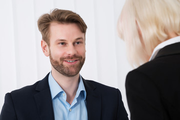 Two Businesspeople Having Conversation