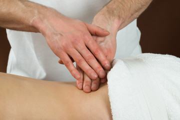 Fototapeta na wymiar Woman Receiving Back Massage In Spa