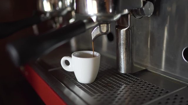 Professional coffee machine makes coffee in a bar.