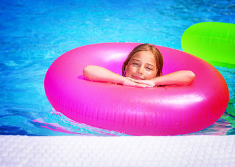 Happy girl in swimming pool