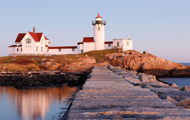 Eastern Point Lighthouse at Gloucester at Sunset, Massachusetts, USA. One of the five iconic lighthouses have been built along the Cape Ann coastline to protect seafarers from rocky shores and shoals.