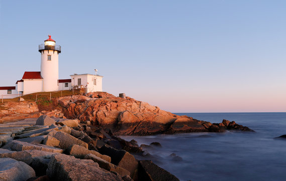 Eastern Point Lighthouse at Gloucester at Sunset, Massachusetts, USA. One of the five iconic lighthouses have been built along the Cape Ann coastline to protect seafarers from rocky shores and shoals.