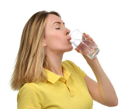 Beautiful Healthy Woman With Drinking Water Glass In Yellow Polo