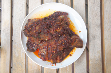 Tilapia with sweet spicy sauce on plate