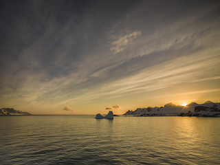Naklejka na ściany i meble summer sunset in antarctica with beautiful winter background