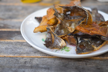 Fish tilapia fried delicious thai food on wood table