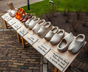 Set of different colorful vintage Dutch wooden clogs.