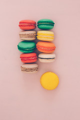 Colorful france macarons on pink background