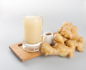 Ginger tea or fresh ginger tea on background.