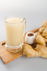 Ginger tea or fresh ginger tea on background.