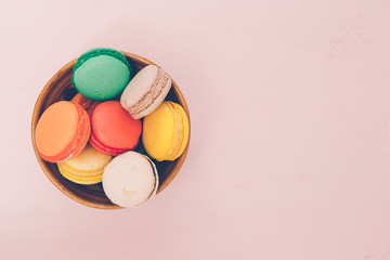 Colorful france macarons on pink background