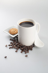 coffee or coffee and chocolate cookie on background.