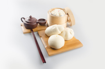 pao or dim sum in bamboo steamer with chinese bun.