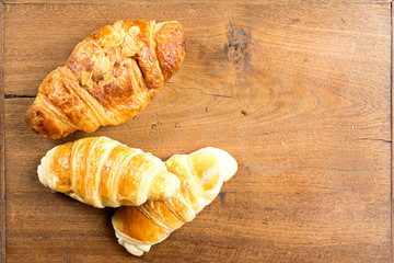 croissant bakery on teak wood table