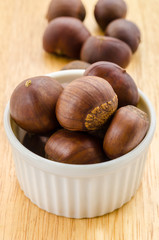 Many chestnut in white bowl.