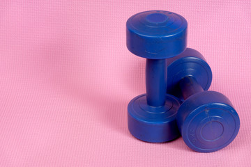 blue dumbells on the pink