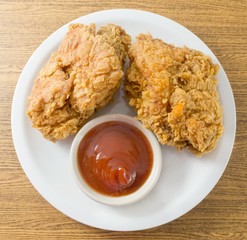 Deep Fried Chicken with Sauce on A White Dish