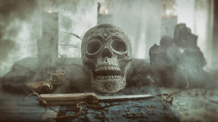 Skull Voodoo Smoke Ritual. Voodoo related objects on a table including a skull, a knife and candles. Smoke or mist. - obrazy, fototapety, plakaty