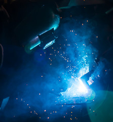 welding worker in the automotive part in Industrial
