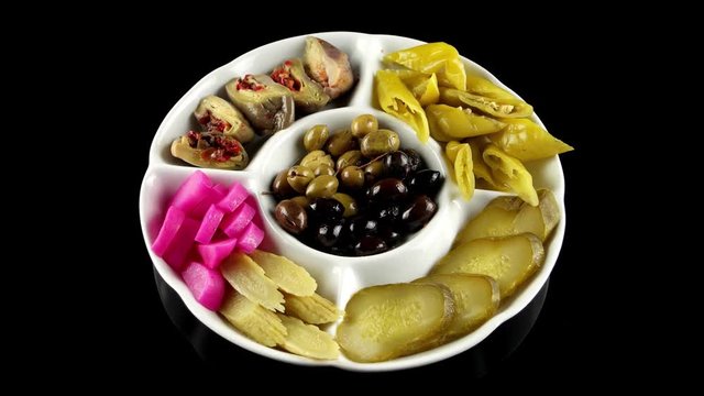 Water pickle from the Arabic region (marinated eggplant, pickled cucumbers and turnips, olives), loop
