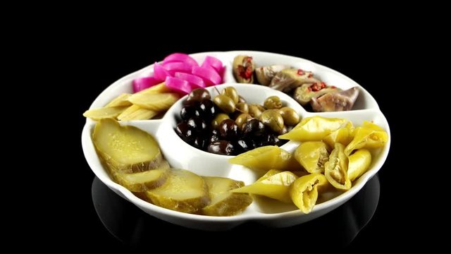 Plate of Arabic pickles (eggplant, cucumbers, turnips, olives), loop