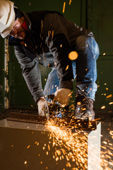 Worker working of a grinding machine