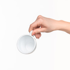 Woman hand with cup on white background