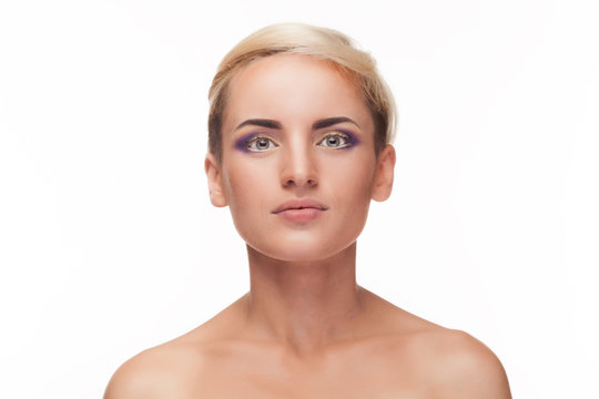 Girl with mauve make up in studio over white background