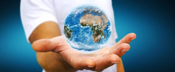 Man holding the planet earth in his hand