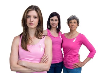 Women in pink outfits posing for breast cancer awareness