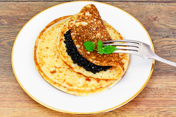 Pancakes with Black Caviar