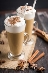 Coffee in glass on the wooden background