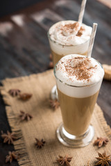 Coffee in glass on the wooden background