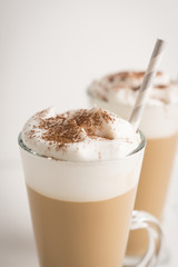 Coffee in glass on the wooden background